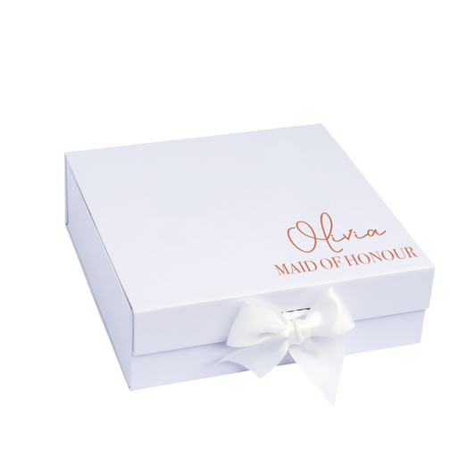 A white gift box with a ribbon, personalized with the name 'Olivia' and the title 'MAID OF HONOUR' on the lid.
