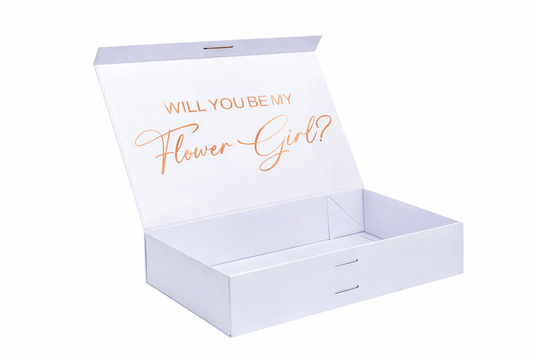 White box with 'Will you be my Flower Girl?' text in rose gold on a white background